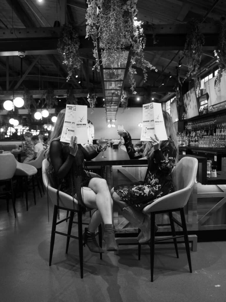 Black-and-white restaurant scene photographed during a hospitality branding campaign.