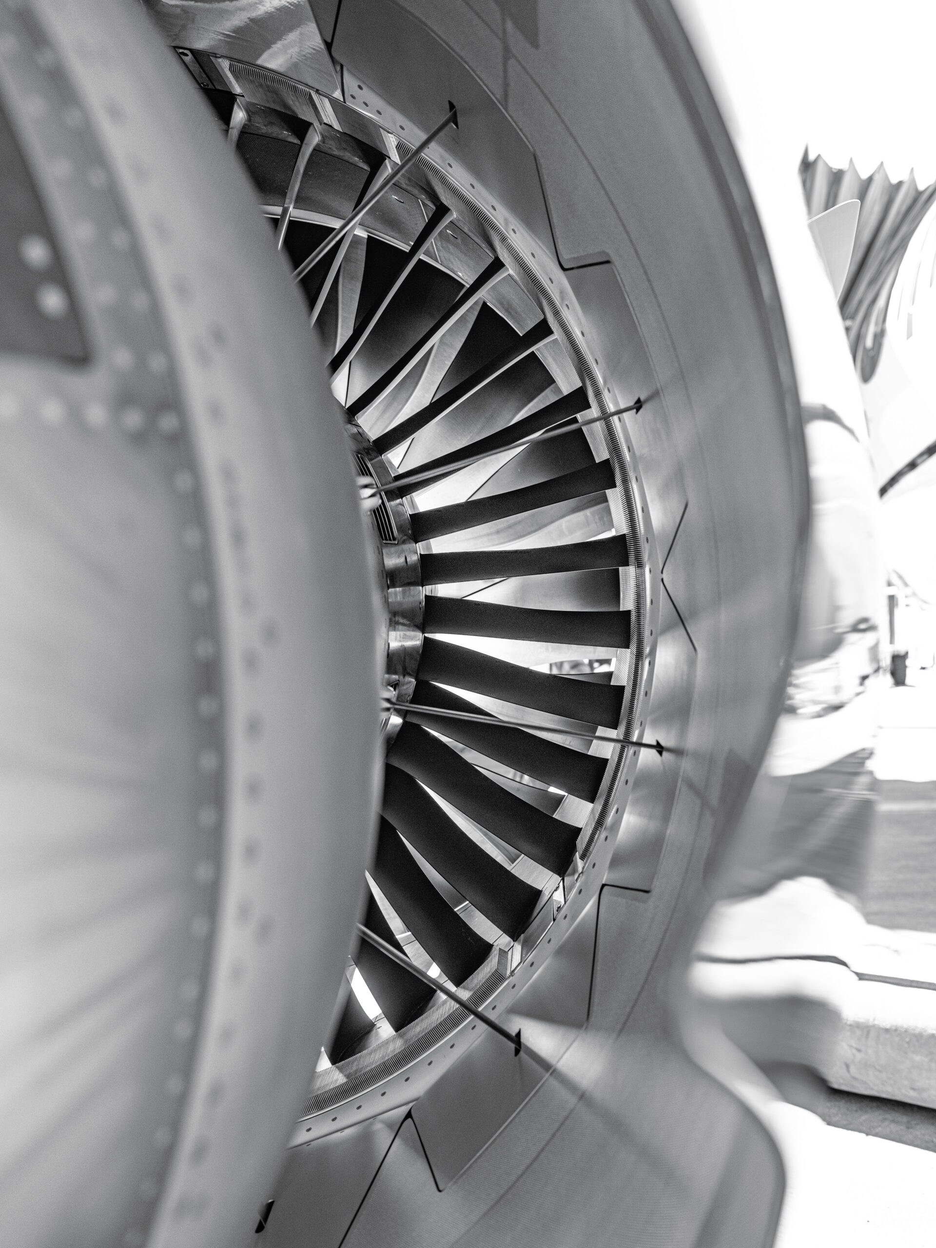 Black-and-white close-up of a commercial aircraft jet engine