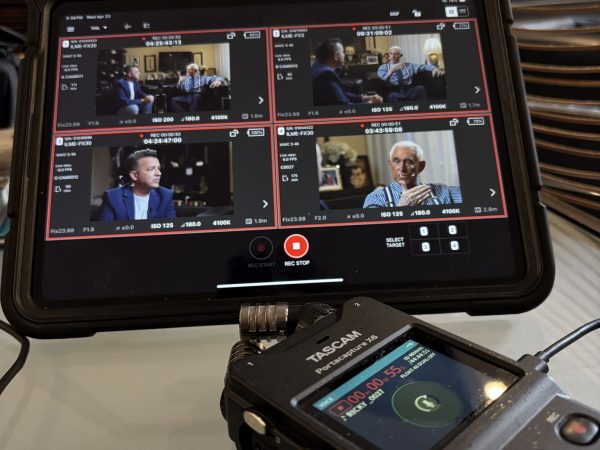 Production monitor displaying multiple camera angles of Roger Stone during an interview.